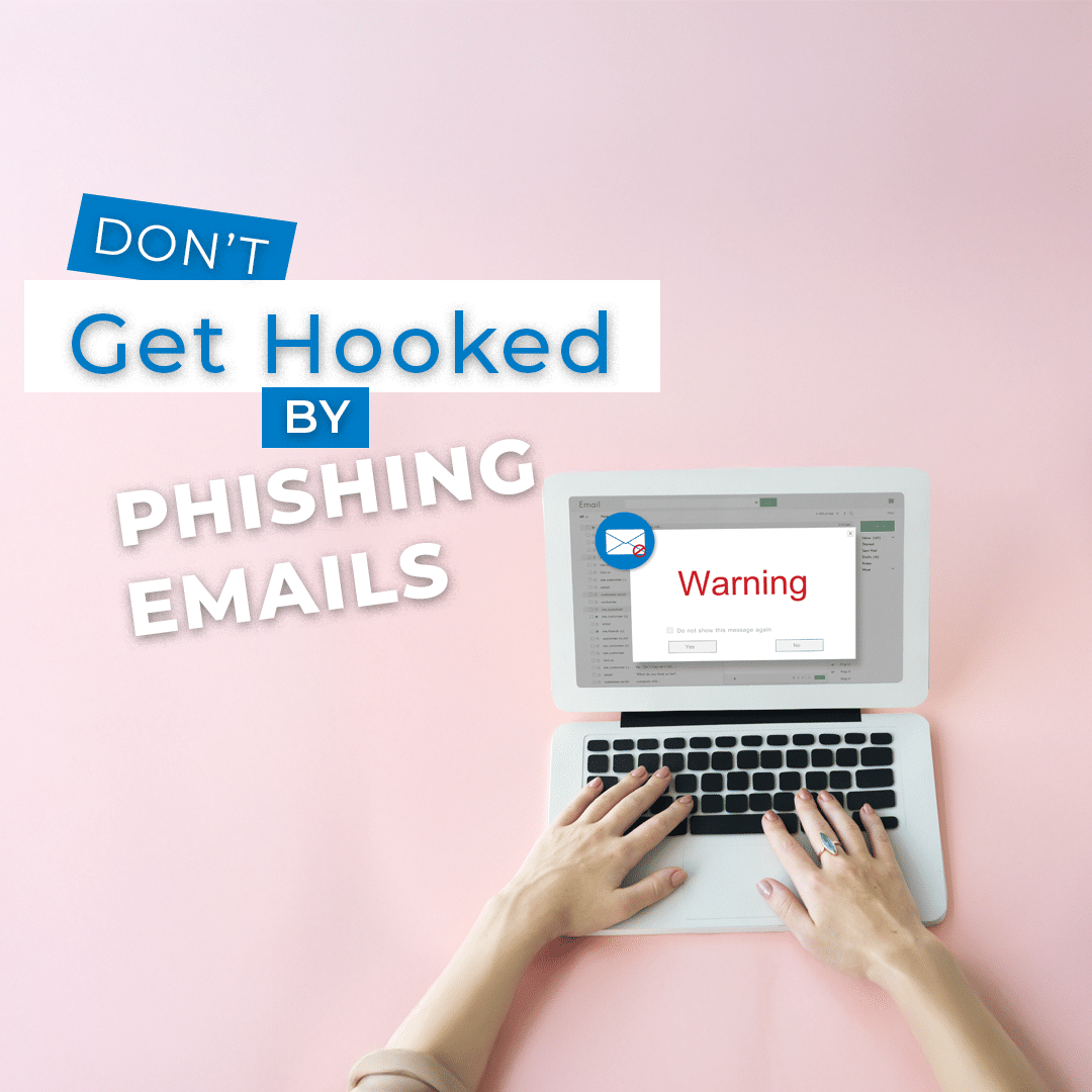 A laptop screen showing a "Warning" message with an email icon, surrounded by the text "Don't Get Hooked by Phishing Emails." The laptop is placed on a pastel pink background, with a person typing on the keyboard.